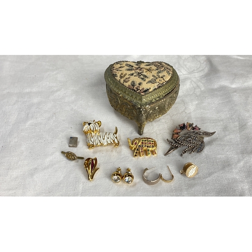 123 - Collection of vintage brooches and earrings featuring gold-tone metal and enamel accents. Includes h... 