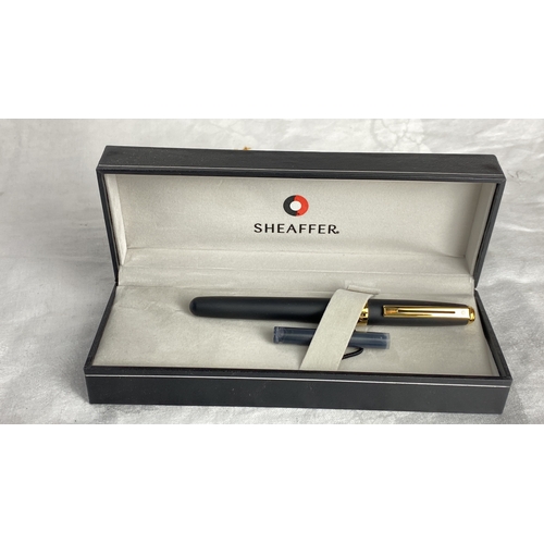 125 - Sheaffer fountain pen with matte black finish and gold-tone accents. It features a classic design wi... 