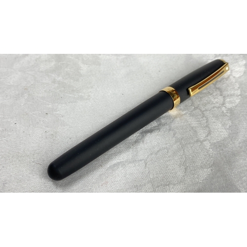 125 - Sheaffer fountain pen with matte black finish and gold-tone accents. It features a classic design wi... 