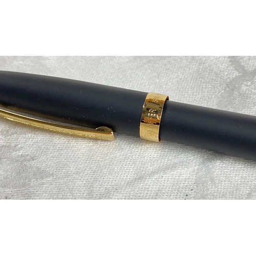 125 - Sheaffer fountain pen with matte black finish and gold-tone accents. It features a classic design wi... 