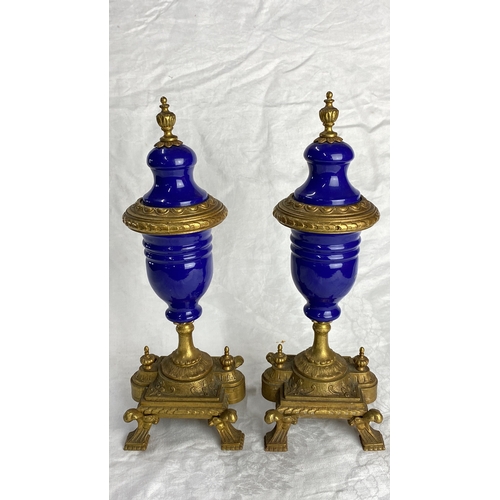 126 - Pair of antique cobalt blue glass and gilt metal urns, intricately designed with ornate detailing. F... 