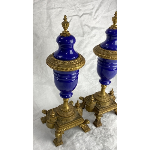 126 - Pair of antique cobalt blue glass and gilt metal urns, intricately designed with ornate detailing. F... 