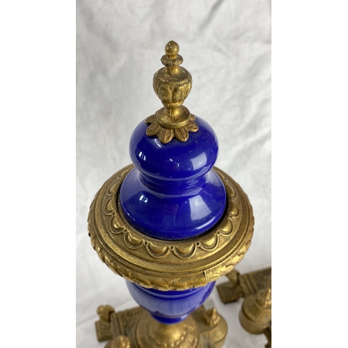 126 - Pair of antique cobalt blue glass and gilt metal urns, intricately designed with ornate detailing. F... 