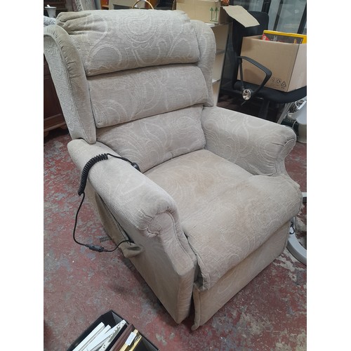 30 - An electric upholstered reclining armchair