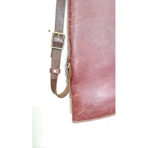 22 - Leather shotgun case with adjustable strap and brass buckle detailing.