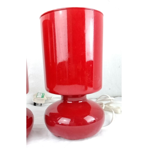 27 - Pair of vintage Ikea red glass table lamps with cylindrical shades.