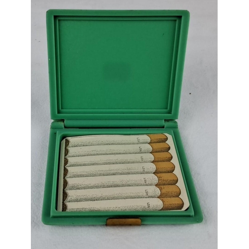 36 - Vintage green Bakelite cigarette case with gold-tone accents.