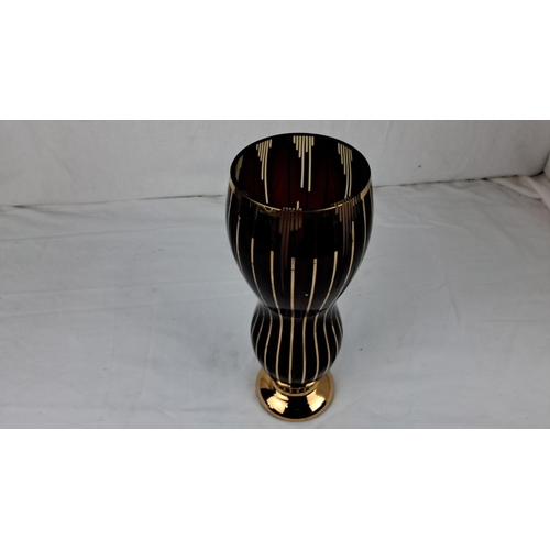 39 - Art Deco-inspired glass vase with elegant gold striping on deep brown finish. It has a flared body a... 