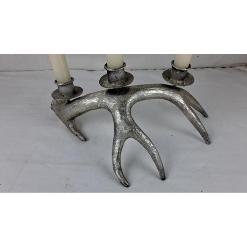 40 - Silver-tone antler candelabra, featuring three candle holders. Rustic design.