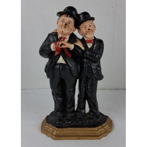 41 - Laurel & Hardy cast iron door stop. Hand-painted details.