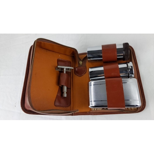 46 - Vintage leather travel shaving kit with chrome accessories, zipper closure.