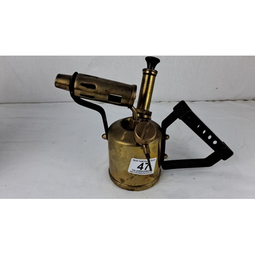 47 - Vintage brass blowtorch with black metal handle, features classic early 20th-century industrial desi... 