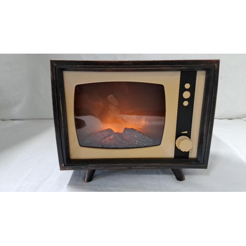 48 - Vintage style TV-shaped novelty nightlight with faux wood casing. Features glowing embers effect.