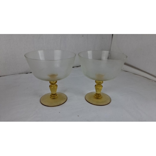 50 - Pair of vintage frosted glass goblets with amber stems, accompanied by a decorative patterned box.