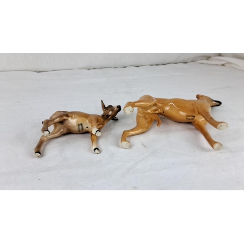 56 - Beswick ceramic figurines of a dog and calf (a/f) have a glossy finish with detailed features. They ... 