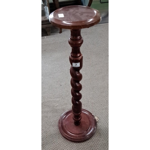 7 - Mahogany plant stand features a barley twist design, round top, and base.