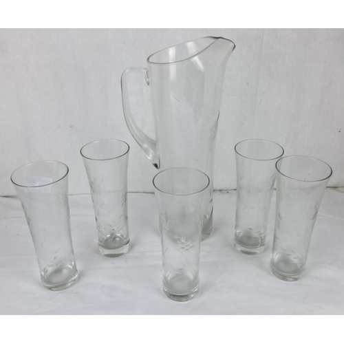 71 - Etched glass pitcher set with five matching glasses, featuring a floral motif.