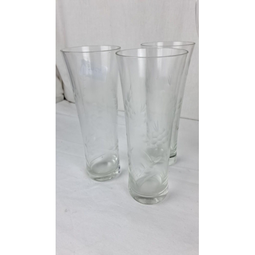 71 - Etched glass pitcher set with five matching glasses, featuring a floral motif.