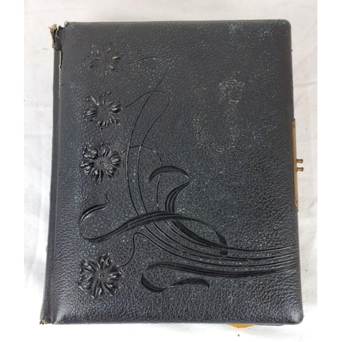 76 - An early antique photo album with embossed floral leather cover, containing vintage portraits and co... 