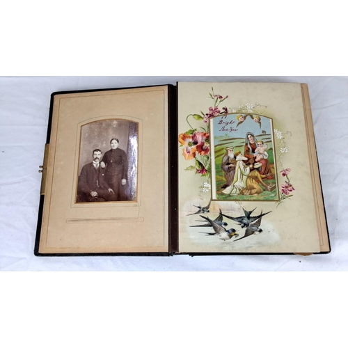 76 - An early antique photo album with embossed floral leather cover, containing vintage portraits and co... 