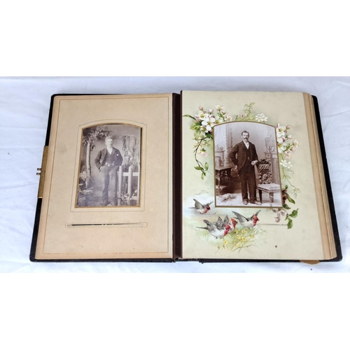 76 - An early antique photo album with embossed floral leather cover, containing vintage portraits and co... 