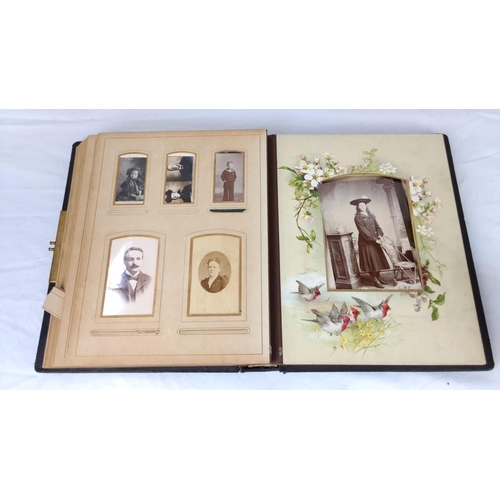 76 - An early antique photo album with embossed floral leather cover, containing vintage portraits and co... 