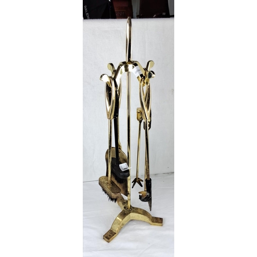 8 - Brass four-piece companion set featuring poker, tongs, shovel, and brush on a stand.