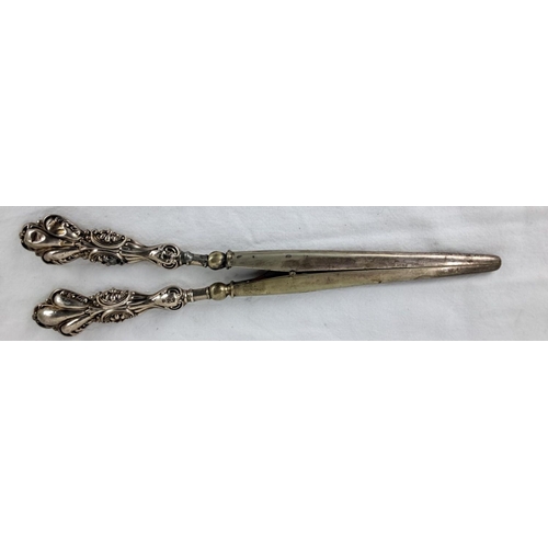 89 - Sterling silver handled glove stretchers with elaborate Baroque-style handles, bearing hallmarks ind... 