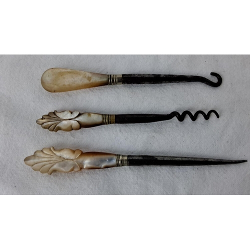 90 - Victorian mother-of-pearl handled tool set, includes a buttonhook, corkscrew, and leather punch. Has... 