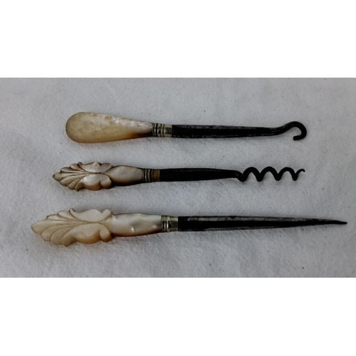 90 - Victorian mother-of-pearl handled tool set, includes a buttonhook, corkscrew, and leather punch. Has... 