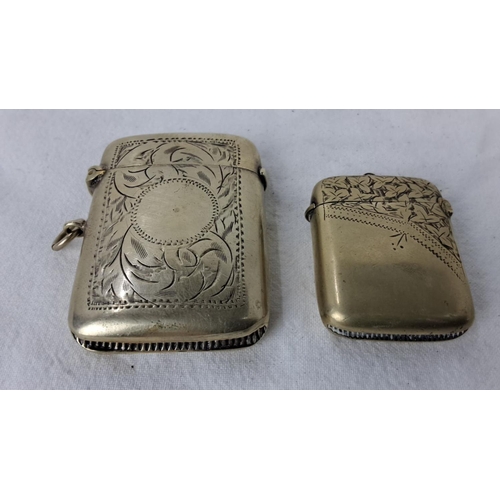 97 - Pair of late 19th-century engraved vesta cases, showcasing ornate floral and geometric patterns. Inc... 