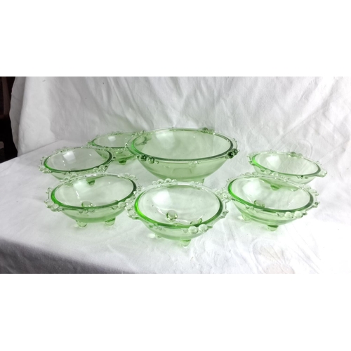 434 - Set of seven green glass bowls with decorative bubble accents, includes one large serving bowl and s... 