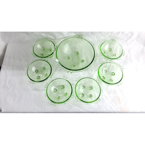 434 - Set of seven green glass bowls with decorative bubble accents, includes one large serving bowl and s... 