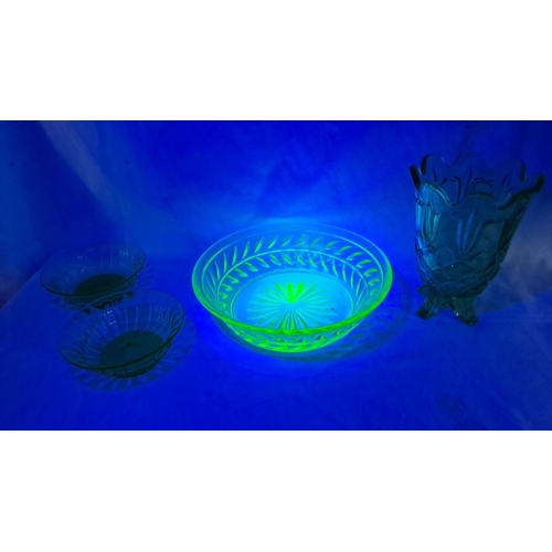 439 - Vintage uranium glass collection features a luminous green bowl under UV light with intricate cut pa... 