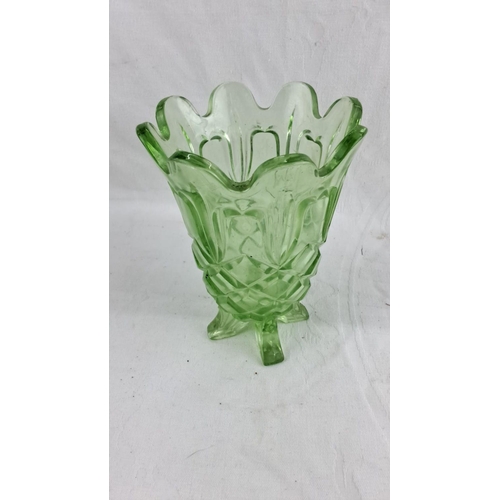 439 - Vintage uranium glass collection features a luminous green bowl under UV light with intricate cut pa... 