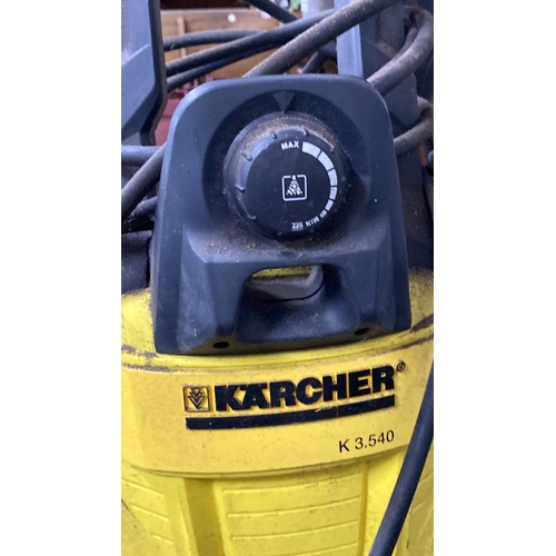 446 - Kärcher pressure washer, model K5 540. Compact design with attached hose and spray gun.