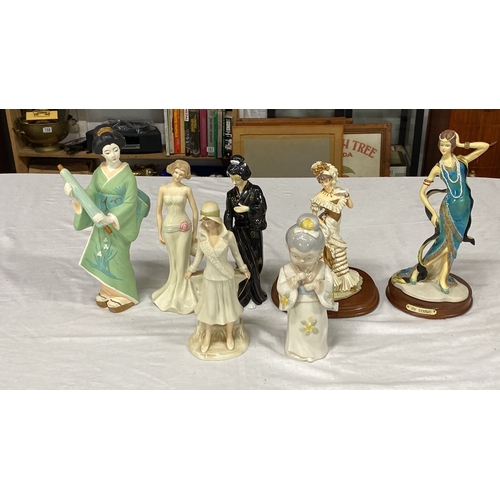 461 - Set of seven porcelain figurines depicting elegantly dressed women in various cultural and historica... 