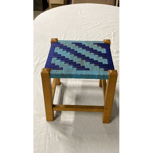 463 - Vintage wooden stool with a woven blue and turquoise geometric pattern seat. Mid-Century Modern styl... 