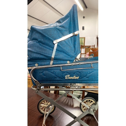 487 - Vintage Swallow stroller, blue fabric with metallic frame and four wheels, from mid-20th century. Cl... 