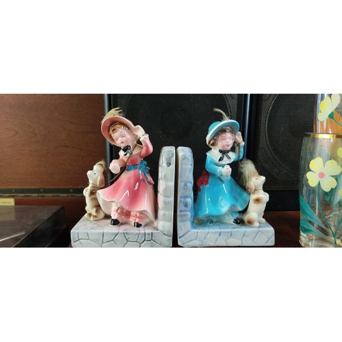 450 - Twin porcelain bookends feature Victorian-style children with dogs, delicately hand-painted with viv... 