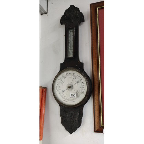 453 - Victorian oak wall barometer with thermometer, featuring aneroid dial. Decorative carving, dual scal... 