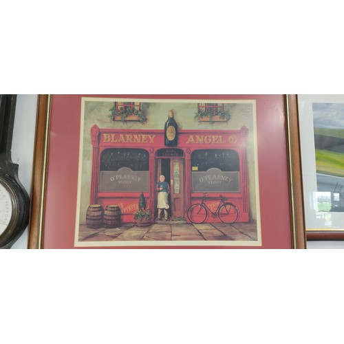 452 - Large Framed print of the Blarney Angel pub, featuring a vibrant street scene. Set in a wooden frame... 