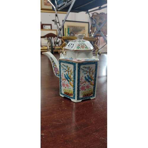 473 - Trio of teapots including a brown ceramic piece with yellow detail, a cobalt blue floral teapot with... 