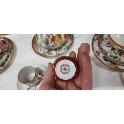 468 - Vintage Japanese Kutani porcelain teacup set featuring intricate Geisha and floral motifs with vibra... 