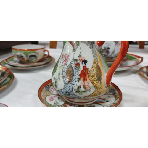 468 - Vintage Japanese Kutani porcelain teacup set featuring intricate Geisha and floral motifs with vibra... 