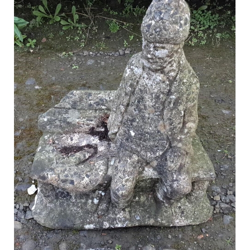 14 - Stone garden statues, depicting a seated figure and a reclining dog with a rustic finish. Cast from ... 