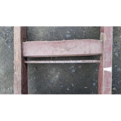 17 - Antique wooden hand truck with metal wheels, showcasing rustic charm, from the early 20th century.