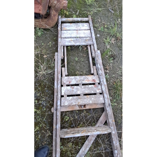 2 - Wooden extension ladder, vintage design, shows natural weathering and paint splatter.