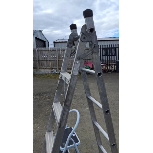 21 - Two aluminum ladders: one step ladder and one extension ladder. Durable construction.