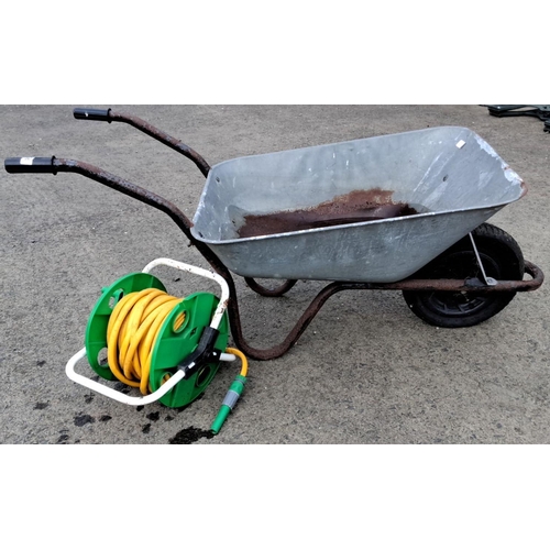 28 - Galvanized wheelbarrow with garden hose reel.